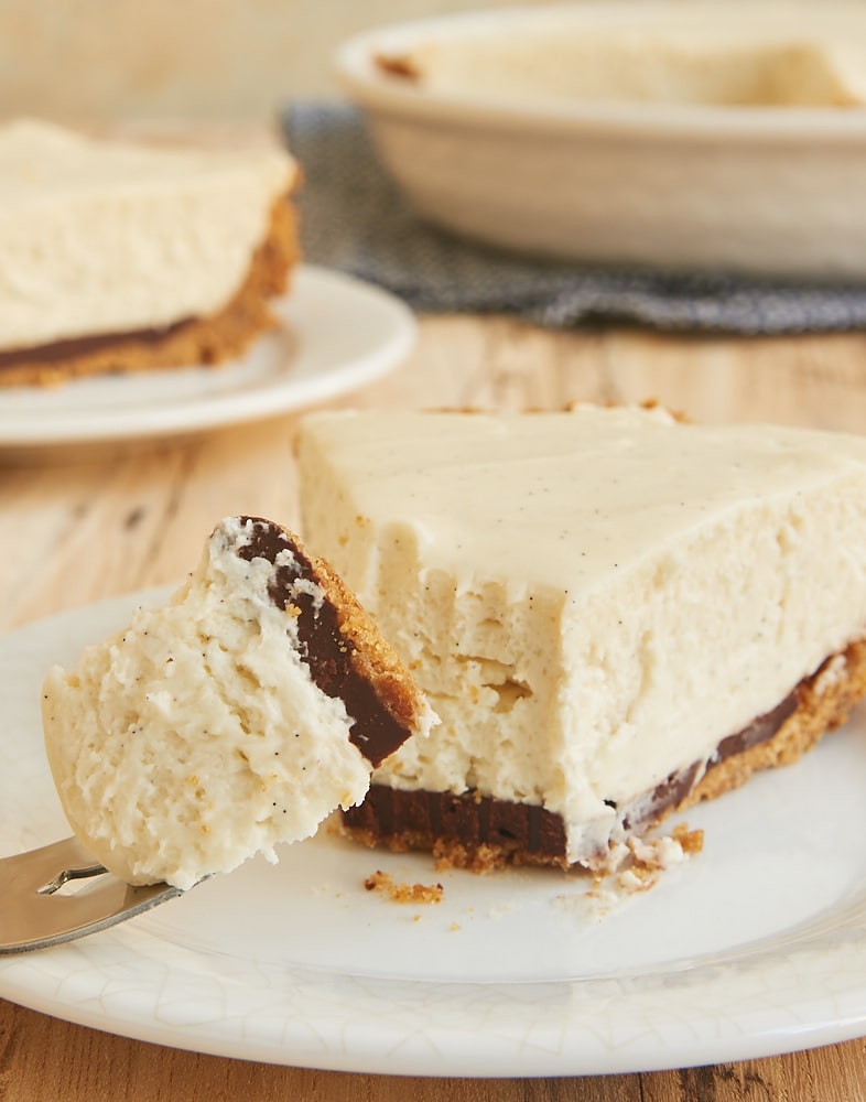 Black Bottom Vanilla Bean Cheesecake is a celebration of vanilla with a little chocolate surprise. This is one delicious dessert! - Bake or Break
