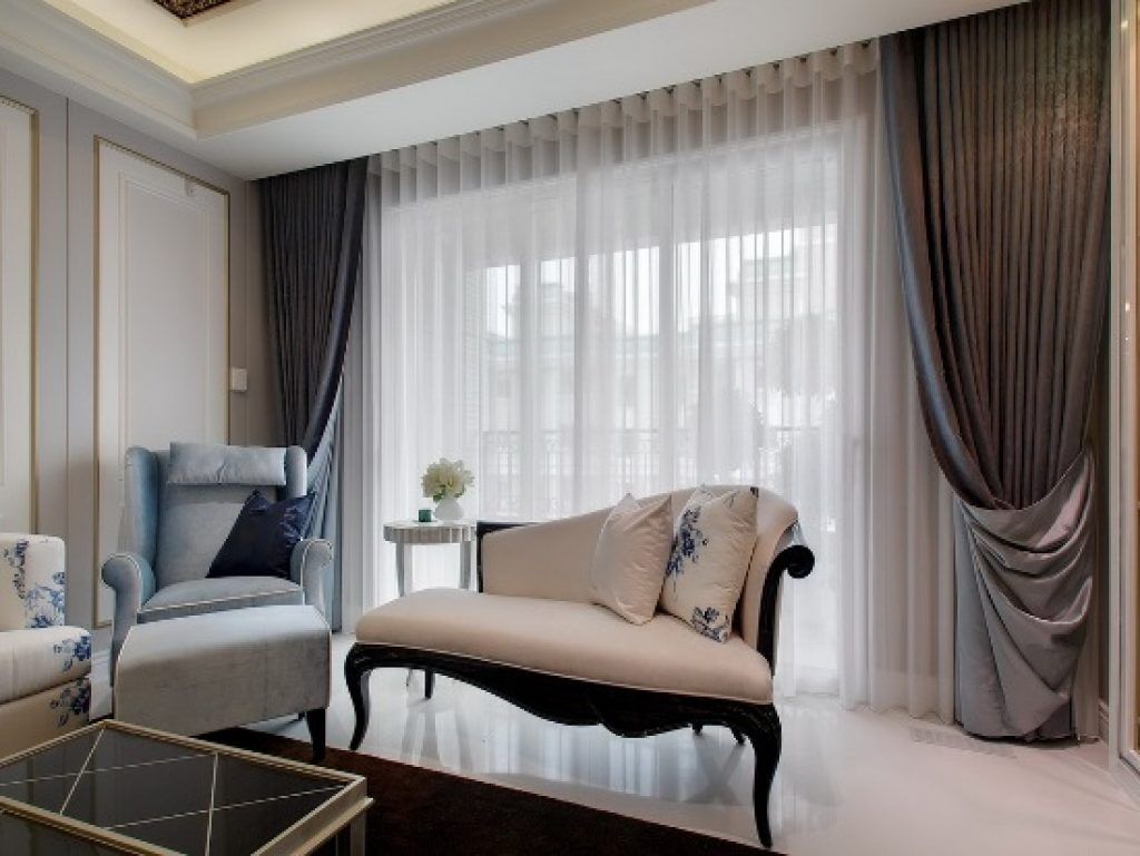 Combining types of curtains is a common decorating strategy.