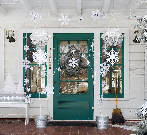 Paper snowflakes is the most simple way to decorate a door for New Year
